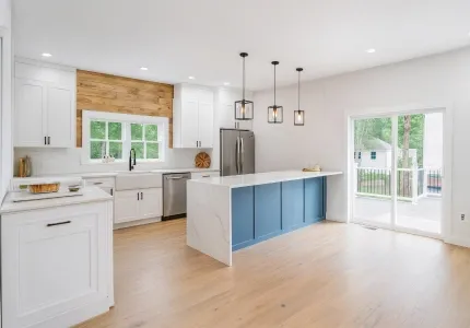 Bright remodeled kitchen with blue island