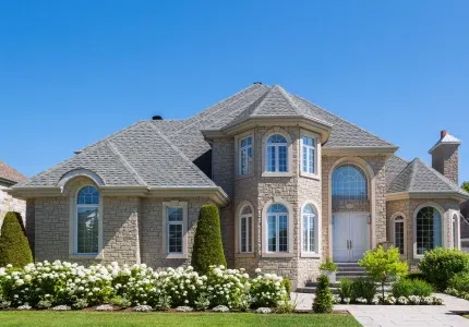 Stone custom home with landscaped front